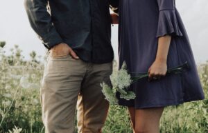 A man and woman giving eachother a side hug