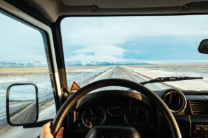 view out the front windshield of a vehicle from the driver's perspective while driving down the road
