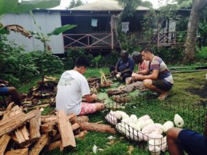 four men working in a small garden