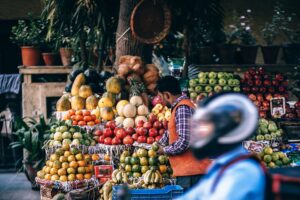 a fruit stand at an outdoor market