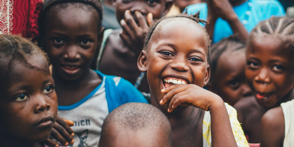 a group of kids smiling at the camera